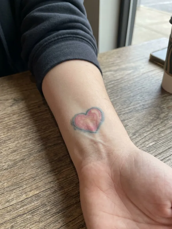 Small colour tattoos: the old tattoo before a cover-up